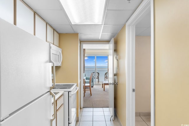 2000 Ocean Blvd N Unit Ph12, Myrtle Beach, SC 29577 - corridor featuring light tile patterned flooring, a drop ceiling, and baseboards