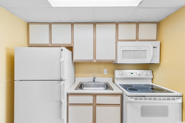 2000 Ocean Blvd N Unit Ph12, Myrtle Beach, SC 29577 - kitchen with white appliances, a sink, light countertops, white cabinets, and a paneled ceiling