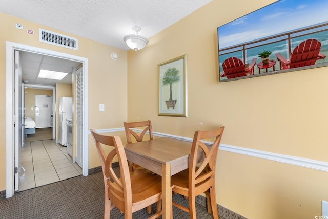 2000 Ocean Blvd N Unit Ph12, Myrtle Beach, SC 29577 - carpeted dining room with tile patterned flooring and baseboards