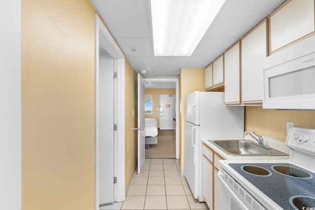 2000 Ocean Blvd N Unit Ph12, Myrtle Beach, SC 29577 - kitchen with white appliances, light tile patterned flooring, a sink, light countertops, and a paneled ceiling