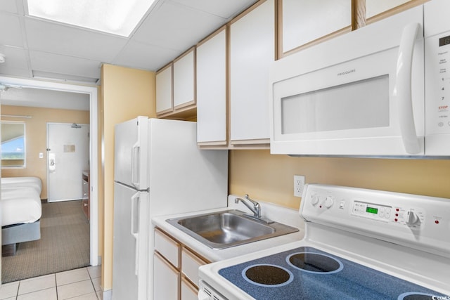2000 Ocean Blvd N Unit Ph12, Myrtle Beach, SC 29577 - kitchen featuring white appliances, a sink, light countertops, and light tile patterned flooring