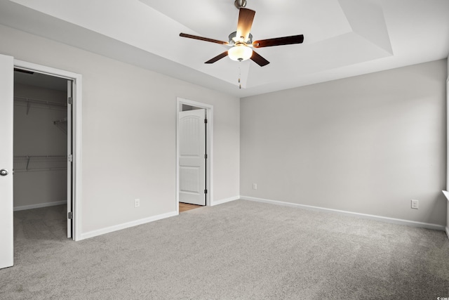 192 Six Mile Creek Dr, Georgetown, SC 29440 - unfurnished bedroom featuring carpet flooring, a spacious closet, baseboards, a closet, and a ceiling fan