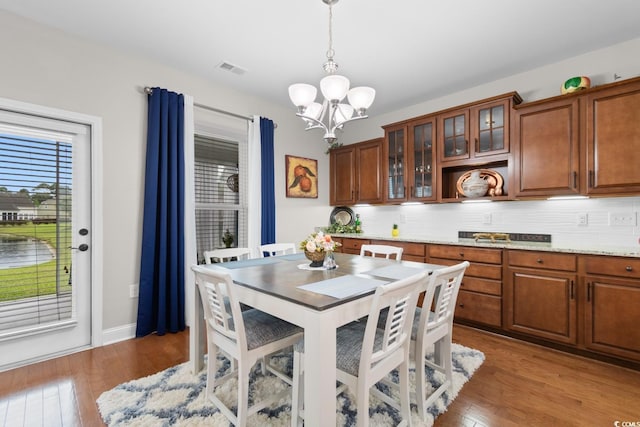1035 Brentford Pl, Myrtle Beach, SC 29579 - dining room with a chandelier and wood finished floors