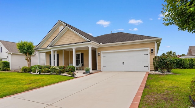 1035 Brentford Pl, Myrtle Beach, SC 29579 - view of front of house with covered porch, a front lawn, concrete driveway, and an attached garage