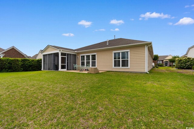 1035 Brentford Pl, Myrtle Beach, SC 29579 - back of property featuring a sunroom, a lawn, and a patio area