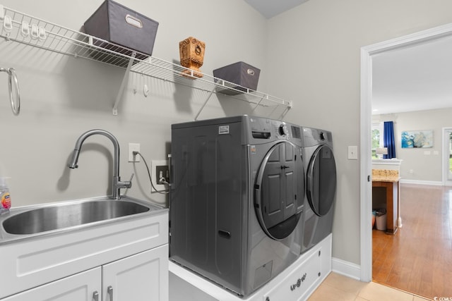 1035 Brentford Pl, Myrtle Beach, SC 29579 - clothes washing area with cabinet space, separate washer and dryer, and baseboards