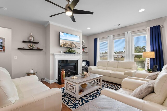 1035 Brentford Pl, Myrtle Beach, SC 29579 - living area with a ceiling fan, wood finished floors, a glass covered fireplace, recessed lighting, and baseboards