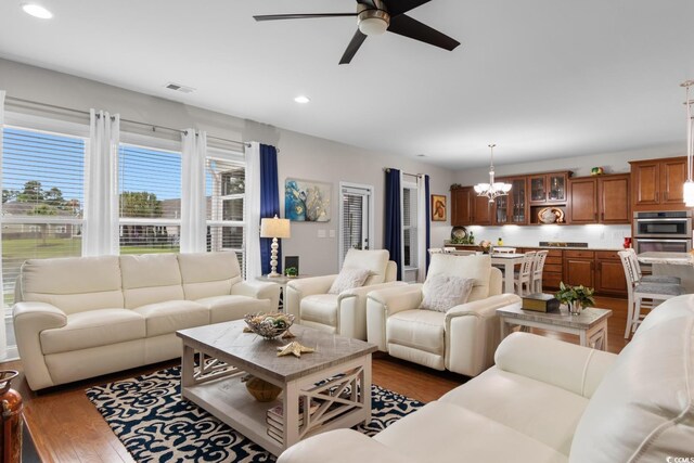 1035 Brentford Pl, Myrtle Beach, SC 29579 - living room with ceiling fan, a chandelier, recessed lighting, and dark wood-type flooring