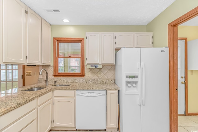 934 Tiffany Ln, North Myrtle Beach, SC 29582 - kitchen featuring white appliances, a sink, tasteful backsplash, light stone countertops, and recessed lighting