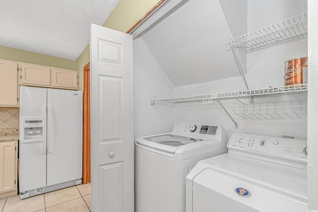 934 Tiffany Ln, North Myrtle Beach, SC 29582 - washroom with washing machine and dryer and light tile patterned flooring