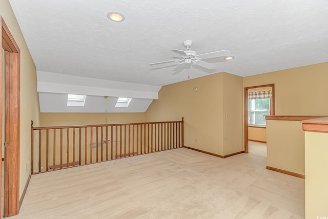 934 Tiffany Ln, North Myrtle Beach, SC 29582 - bonus room with a skylight, ceiling fan, light carpet, baseboards, and recessed lighting