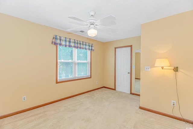 934 Tiffany Ln, North Myrtle Beach, SC 29582 - spare room featuring baseboards, a ceiling fan, and light carpet