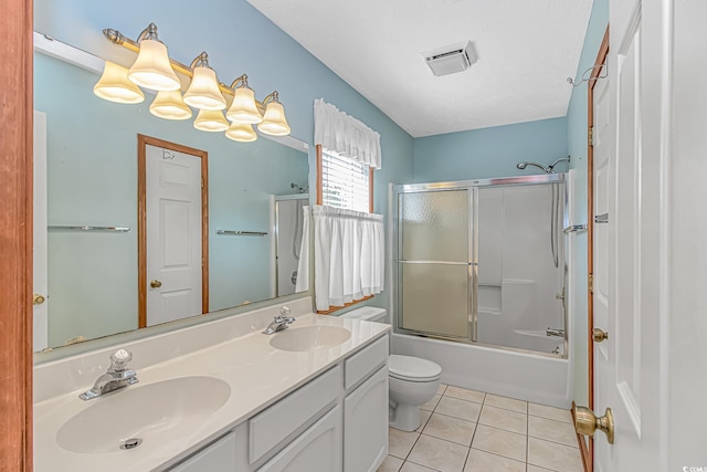 934 Tiffany Ln, North Myrtle Beach, SC 29582 - bathroom featuring toilet, double vanity, tile patterned floors, and shower / bath combination with glass door