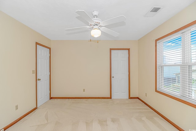 934 Tiffany Ln, North Myrtle Beach, SC 29582 - empty room featuring plenty of natural light, baseboards, light colored carpet, and ceiling fan