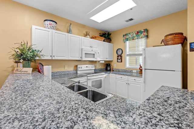601 Hillside Dr Unit 4424, North Myrtle Beach, SC 29582 - kitchen with white appliances, a sink, and white cabinetry