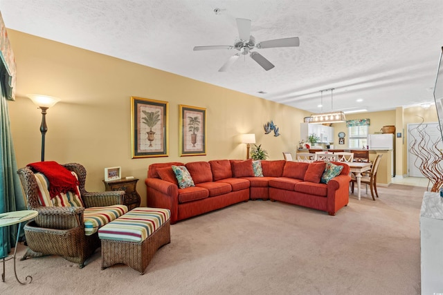 601 Hillside Dr Unit 4424, North Myrtle Beach, SC 29582 - living area with a textured ceiling, light colored carpet, and a ceiling fan