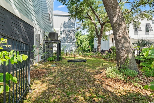 view of yard featuring fence and cooling unit