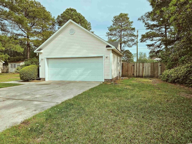 garage featuring concrete driveway