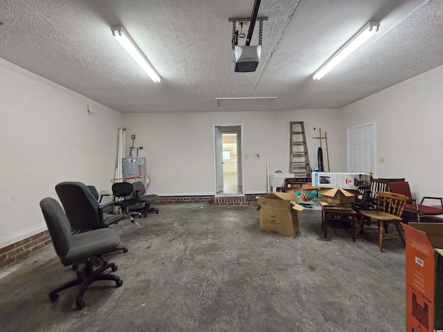 garage with a garage door opener and water heater