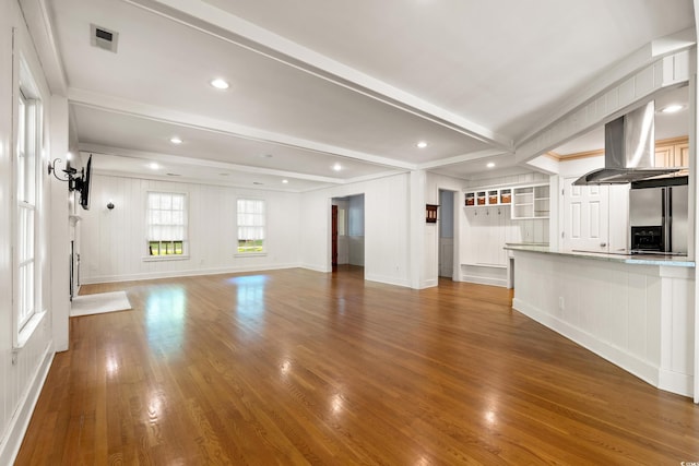 54 River Birch Ln, Pawleys Island, SC 29585 - unfurnished living room featuring beamed ceiling, crown molding, wood finished floors, and baseboards