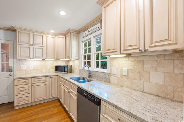 54 River Birch Ln, Pawleys Island, SC 29585 - kitchen with appliances with stainless steel finishes, a sink, cream cabinets, light stone counters, and recessed lighting