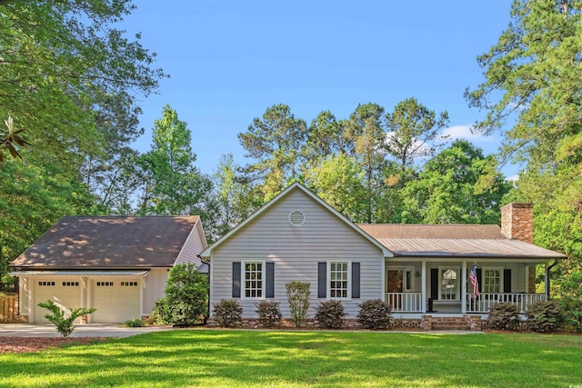 54 River Birch Ln, Pawleys Island, SC 29585 - ranch-style house with a porch, a chimney, a front yard, concrete driveway, and an attached garage