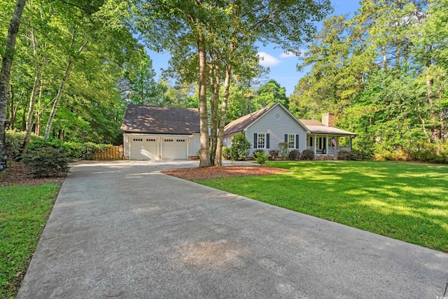 54 River Birch Ln, Pawleys Island, SC 29585 - single story home with a chimney and a detached garage
