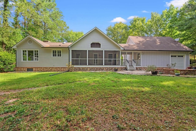54 River Birch Ln, Pawleys Island, SC 29585 - back of house with a lawn, a sunroom, a garage, and crawl space