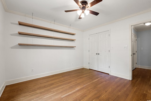 54 River Birch Ln, Pawleys Island, SC 29585 - unfurnished bedroom featuring wood finished floors, crown molding, baseboards, a closet, and a ceiling fan