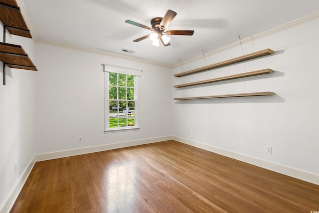 54 River Birch Ln, Pawleys Island, SC 29585 - empty room featuring wood finished floors, ceiling fan, baseboards, and crown molding