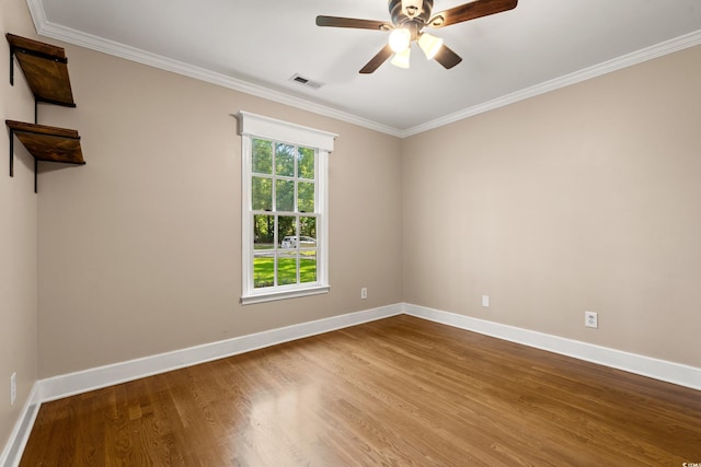 54 River Birch Ln, Pawleys Island, SC 29585 - spare room with baseboards, wood finished floors, a ceiling fan, and crown molding