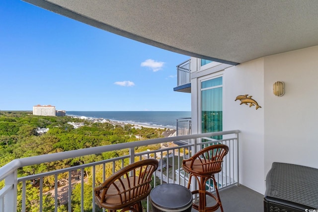 balcony featuring a water view