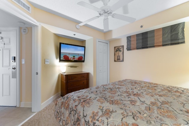 bedroom featuring a closet, ceiling fan, and baseboards