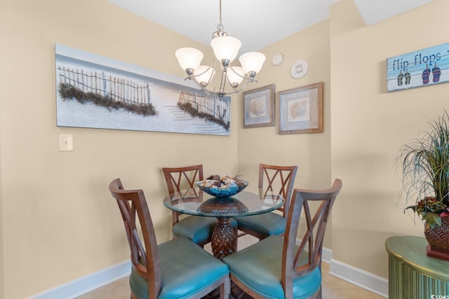 dining space with a chandelier and baseboards