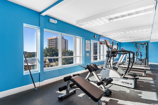 gym featuring baseboards