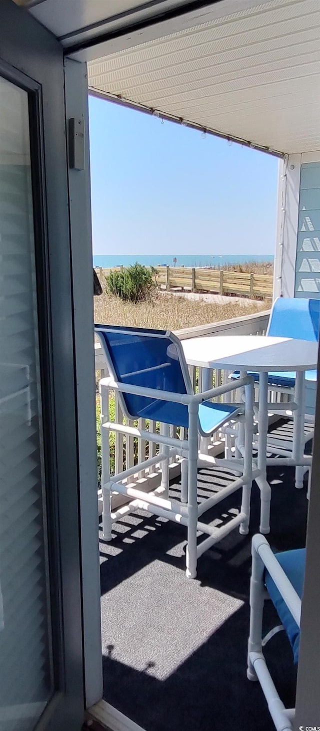 balcony featuring a water view