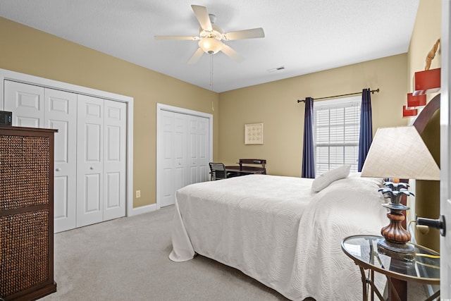 4355 Willoughby Ln Unit 401, Myrtle Beach, SC 29577 - bedroom featuring carpet flooring, multiple closets, baseboards, and a ceiling fan