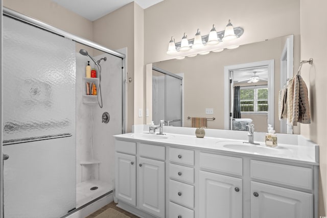 4355 Willoughby Ln Unit 401, Myrtle Beach, SC 29577 - full bathroom featuring a shower stall, ensuite bathroom, double vanity, and ceiling fan