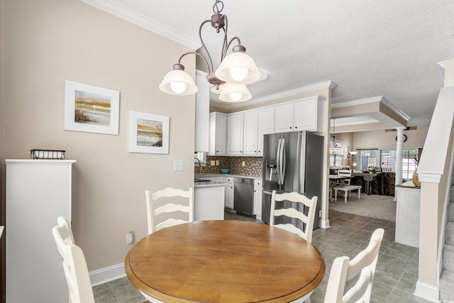 4355 Willoughby Ln Unit 401, Myrtle Beach, SC 29577 - tiled dining space featuring crown molding and baseboards