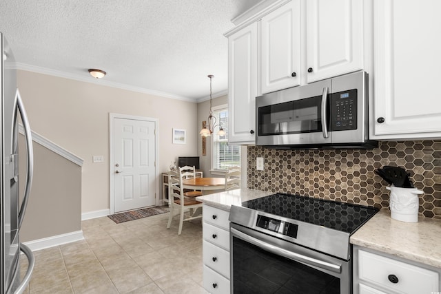 4355 Willoughby Ln Unit 401, Myrtle Beach, SC 29577 - kitchen with stainless steel appliances, backsplash, crown molding, white cabinetry, and light tile patterned floors