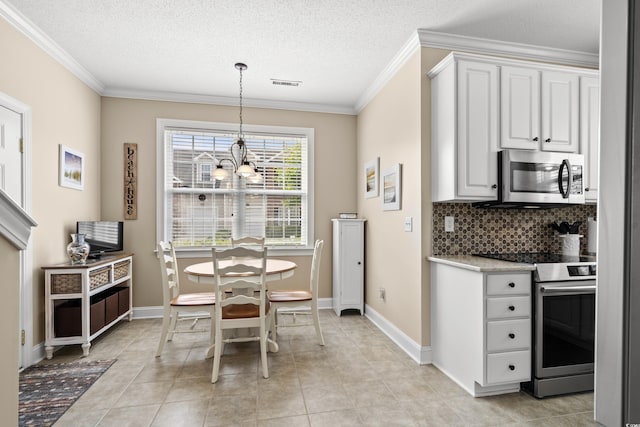4355 Willoughby Ln Unit 401, Myrtle Beach, SC 29577 - dining space with a chandelier, crown molding, a textured ceiling, baseboards, and light tile patterned floors