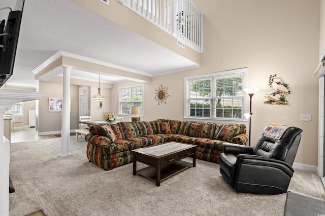 4355 Willoughby Ln Unit 401, Myrtle Beach, SC 29577 - living area featuring decorative columns, carpet flooring, crown molding, and baseboards