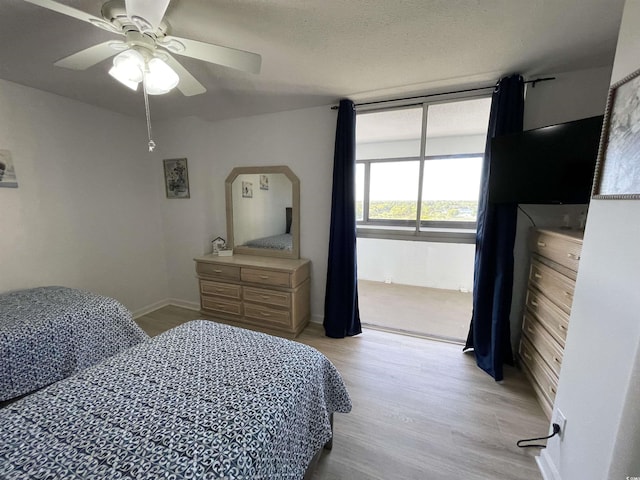 9500 Shore Dr Unit 17B, Myrtle Beach, SC 29572 - bedroom with light wood-style floors and a ceiling fan