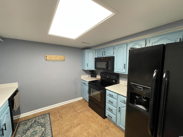 9500 Shore Dr Unit 17B, Myrtle Beach, SC 29572 - kitchen featuring black appliances, light countertops, and blue cabinets