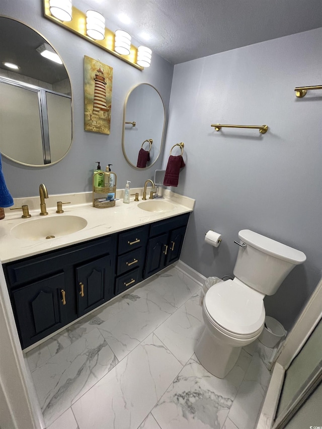 9500 Shore Dr Unit 17B, Myrtle Beach, SC 29572 - bathroom featuring marble finish flooring, double vanity, and a shower with shower door
