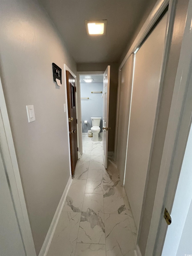 9500 Shore Dr Unit 17B, Myrtle Beach, SC 29572 - corridor featuring light marble finish floors and baseboards
