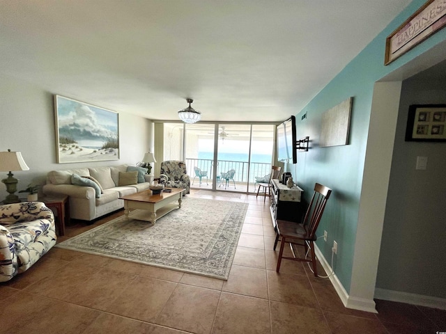 9500 Shore Dr Unit 17B, Myrtle Beach, SC 29572 - living room with a wall of windows and tile patterned flooring