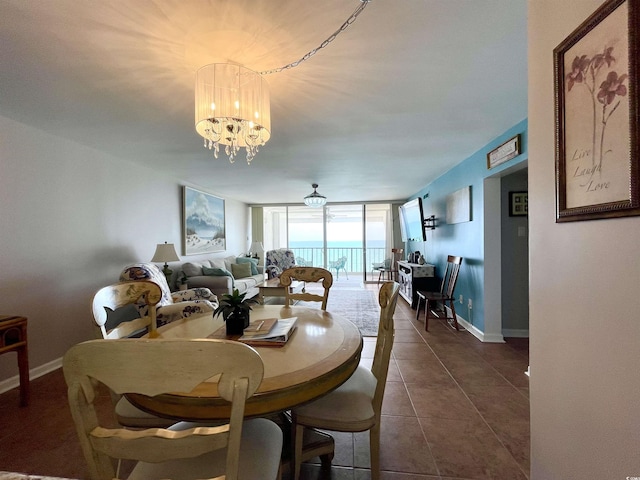 9500 Shore Dr Unit 17B, Myrtle Beach, SC 29572 - dining space featuring expansive windows, a chandelier, and dark tile patterned floors