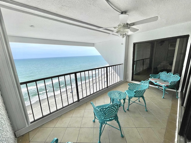 9500 Shore Dr Unit 17B, Myrtle Beach, SC 29572 - balcony featuring a ceiling fan and view of water and beach
