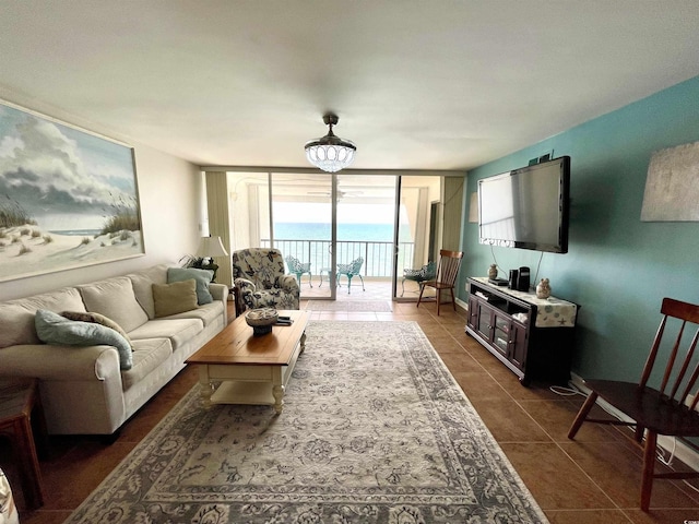 9500 Shore Dr Unit 17B, Myrtle Beach, SC 29572 - living room featuring dark tile patterned flooring and expansive windows